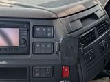 a car dashboard with a steering wheel and a dash board