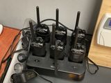 a table with a bunch of walkie talkies on it