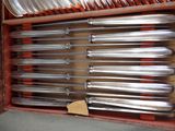 a lot of silverware in a box on the table