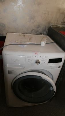 a washer and dryer sitting next to each other in a room