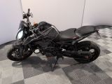 a motorcycle that is parked on a checkered floor