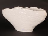 a white bowl that is sitting on a table