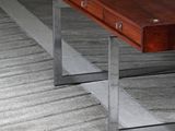 a wooden table with metal legs and a wooden table top