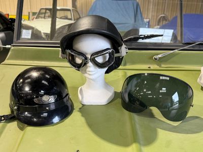 a helmet, goggles, and a helmet on a table