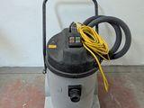 an image of a wet dryer sitting on the floor