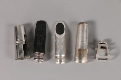 several different types of tools are lined up on a white surface