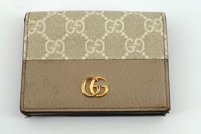 Portefeuille Guccissi avec logo GG doré sur le devant