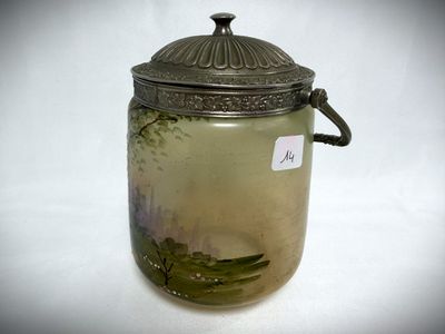a glass jar with a lid on a white surface