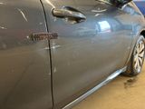 a close up of a car door with a sticker on it
