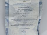 the certificate is in a bag on a white surface