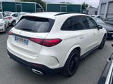 the rear of a white mercedes suv parked in a parking lot