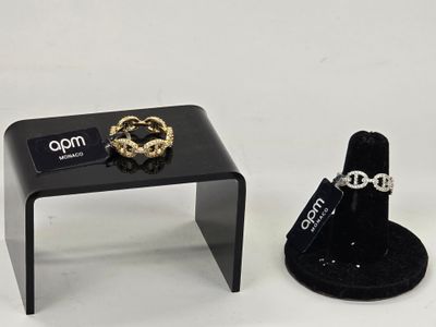 a small table with a ring on it next to a ring holder