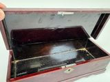 a small wooden box that has a lock on it