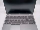 an open laptop computer sitting on top of a white table