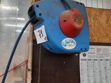 a picture of a blue machine with a red ball on it