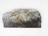 a rock that is sitting on top of a white surface