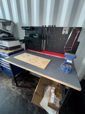 a workbench with a lot of tools on it