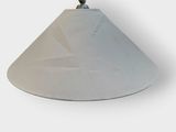 a white cone with a black handle sitting on a table