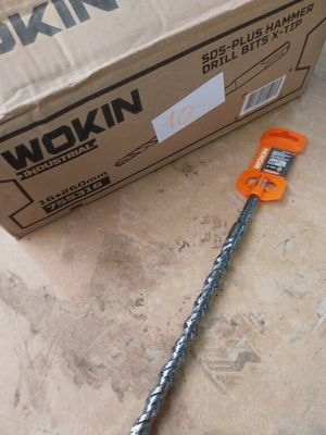 a box of workin tools on the floor next to it