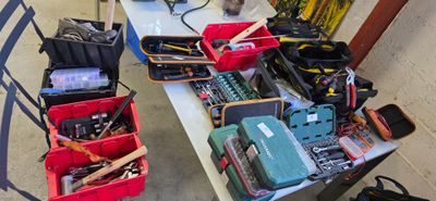 a table with many tools on it in a room