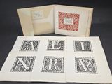 an open book with a picture of the letters n and a picture of the letter n on it