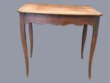 a small table with a wooden top on a gray background