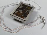 a picture of a necklace with a picture inside of it