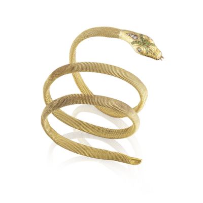 an image of a gold snake ring with a snake on it ' s back