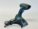a blue and black handheld barcode scanner on a white surface