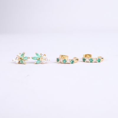 a pair of emerald and diamond stud earrings