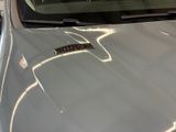 a car that has a sticker on the hood of it