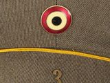 an image of a hat with a red eye on it