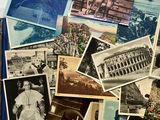 many old photos of people and buildings on the table