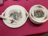 two plates on a table with a pink table cloth