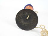 a wooden spool with a rope around it on a white surface