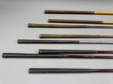 several different types of baseball bats are lined up on a table