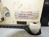 a close up of a sewing machine on a table
