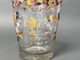 a glass cup with a design on it on a table