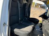 a white van with two black seats in the back of it