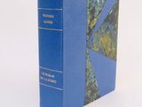 a blue book with a picture of a tree on it