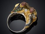 an image of a gold and silver ring with multi colored stones