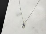 a close up of a necklace on a mannequin display