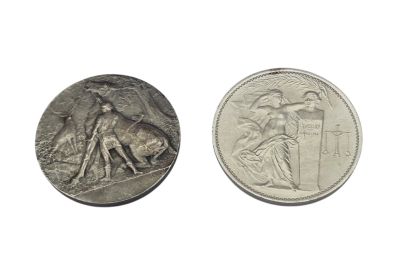 an image of a silver coin with a picture of a woman on it