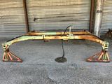 an image of a rusted metal bench in front of a garage