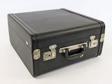 a black suitcase that is sitting on a white surface