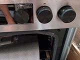 a roll of toilet paper in the oven door