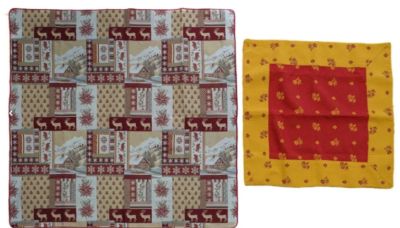 two pieces of cloth that are on a white surface