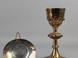 two silver and gold goblets and a silver plate