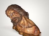 an image of a wooden statue of a man with a beard