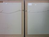 two doors that have been painted white and one has a pair of scissors on them